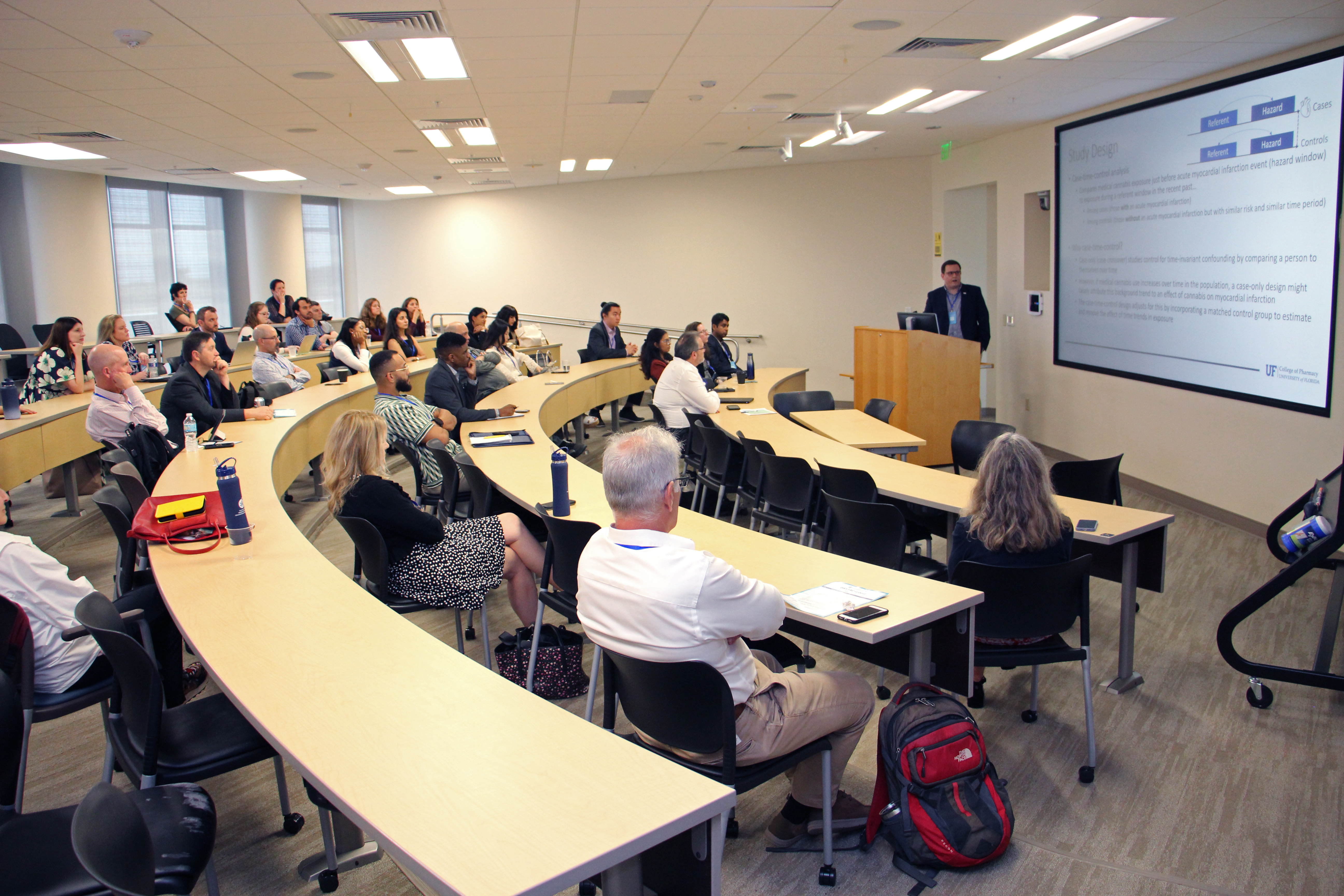 An audience of attendees watching a session at CCORC